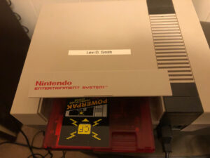 Inserting PowerPak into NES (Nintendo Entertainment System) console